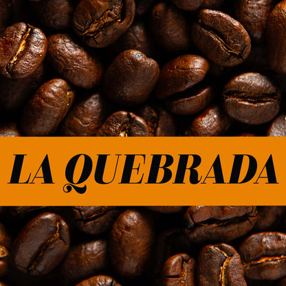 La Quebrada banner over roasted coffee beans